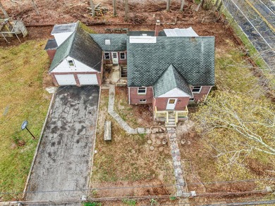 This spacious corner property nestled on a estimated half-acre - photo 12