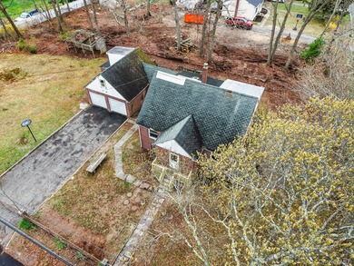 This spacious corner property nestled on a estimated half-acre - photo 13