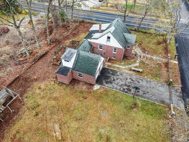 This spacious corner property nestled on a estimated half-acre - photo 15