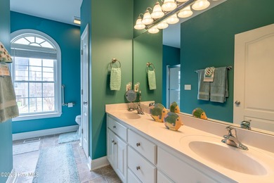 Experience the ultimate in coastal living at this custom-built