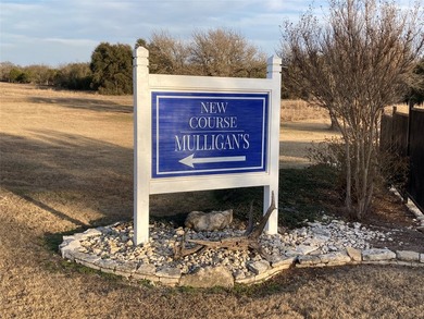 This property is on the new golf course, backs up to tee box # - photo 2