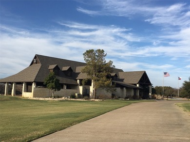 This property is on the new golf course, backs up to tee box # - photo 3