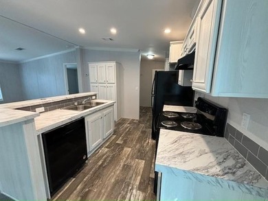 Own your own home in a quiet, well-maintained neighborhood! This - photo 2