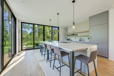 Newly built in 2022, this near-new, net-zero modern sanctuary in - photo 6
