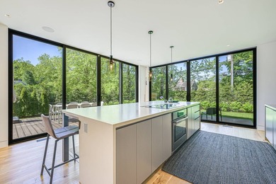 Newly built in 2022, this near-new, net-zero modern sanctuary in - photo 7