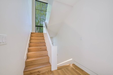 Newly built in 2022, this near-new, net-zero modern sanctuary in - photo 8