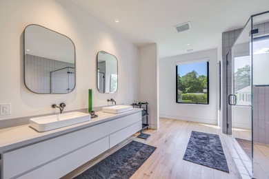 Newly built in 2022, this near-new, net-zero modern sanctuary in - photo 10