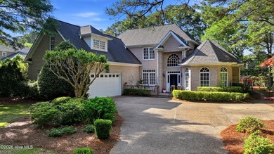 Set within the prestigious community of Landfall, this elegant - photo 1