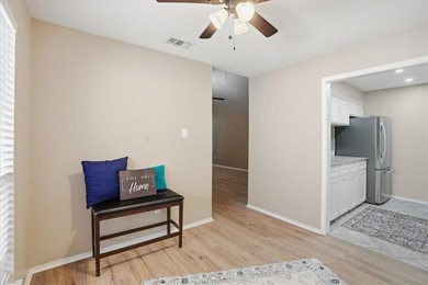Welcome to this charming townhome located in the highly - photo 3