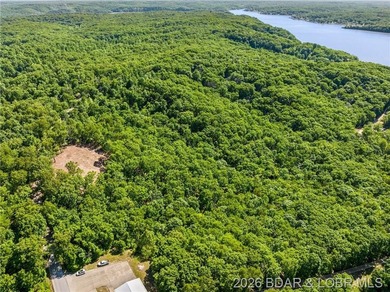 Perched above the Lake of the Ozarks with impressive views and a - photo 12
