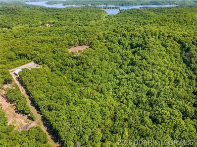 Perched above the Lake of the Ozarks with impressive views and a - photo 13