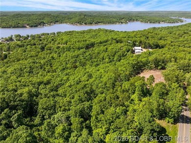 Perched above the Lake of the Ozarks with impressive views and a - photo 14