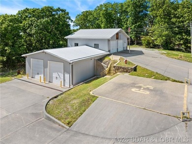 Perched above the Lake of the Ozarks with impressive views and a - photo 26