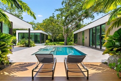 Set on a 39,639 sqft corner lot, this 2023 modern estate offers - photo 1
