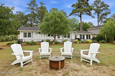 This charming waterfront cottage is tucked along a quiet stretch - photo 8