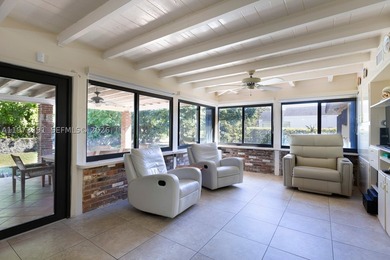This 3-bedroom, 3-bathroom single-family residence sits on an - photo 4