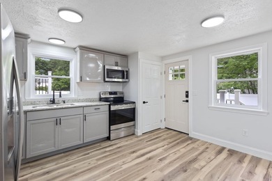 Thoughtful renovations inside and out give this Kennebunk Cape a - photo 10