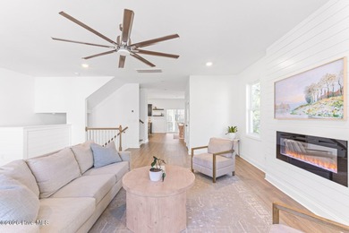 This beautifully appointed, premium end-unit townhome is like