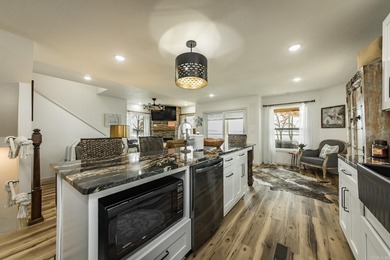 This incredible LAKE HOME, just a little over a year old, offers - photo 13