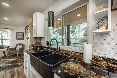 This incredible LAKE HOME, just a little over a year old, offers - photo 14