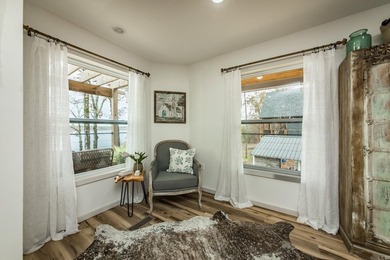 This incredible LAKE HOME, just a little over a year old, offers - photo 15
