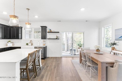 This beautifully appointed, premium end-unit townhome is like