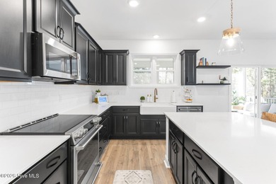 This beautifully appointed, premium end-unit townhome is like