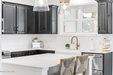 This beautifully appointed, premium end-unit townhome is like