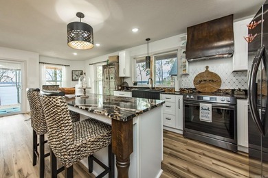 This incredible LAKE HOME, just a little over a year old, offers - photo 21