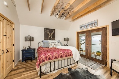 This incredible LAKE HOME, just a little over a year old, offers - photo 23