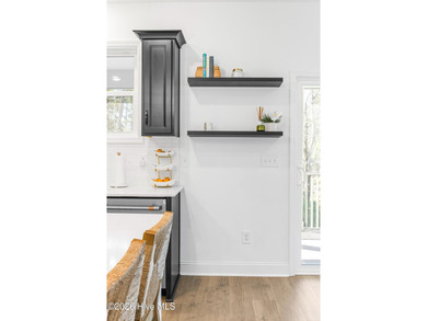 This beautifully appointed, premium end-unit townhome is like