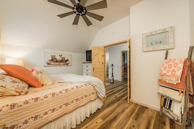 This incredible LAKE HOME, just a little over a year old, offers - photo 29