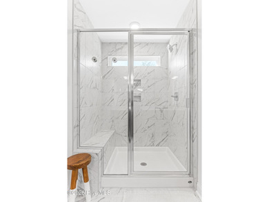 This beautifully appointed, premium end-unit townhome is like