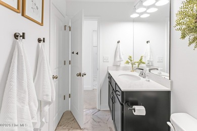 This beautifully appointed, premium end-unit townhome is like