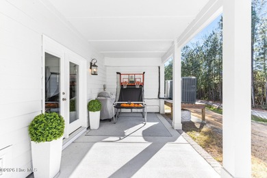 This beautifully appointed, premium end-unit townhome is like