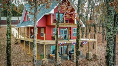 This incredible LAKE HOME, just a little over a year old, offers - photo 46