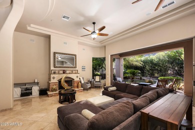 Positioned on an elevated, double-gated homesite within the