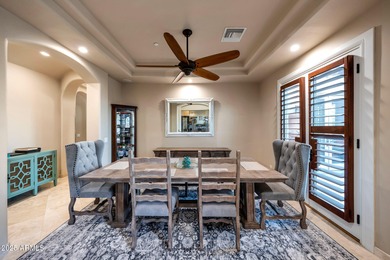 Positioned on an elevated, double-gated homesite within the