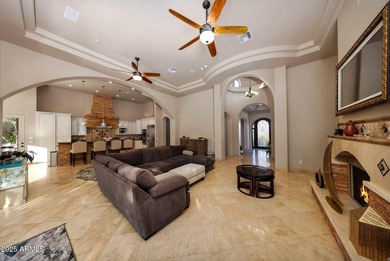 Positioned on an elevated, double-gated homesite within the