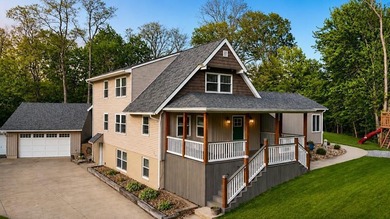 Tucked among the trees on 2 scenic acres just outside the - photo 1