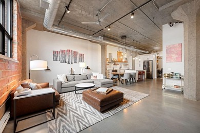 Loft-style living in the North Loop, done right! This oversized - photo 1