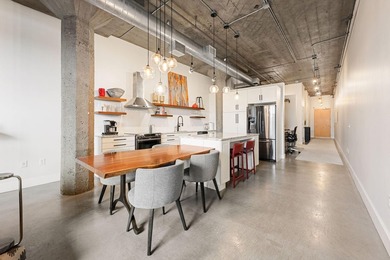 Loft-style living in the North Loop, done right! This oversized - photo 2