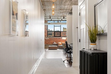 Loft-style living in the North Loop, done right! This oversized - photo 3