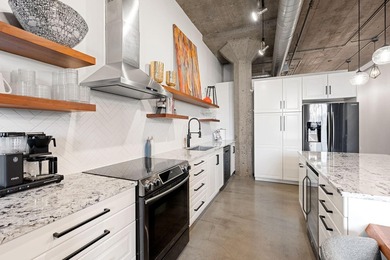 Loft-style living in the North Loop, done right! This oversized - photo 6