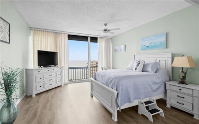 Wake up to sweeping ocean views from this beautifully refreshed - photo 11