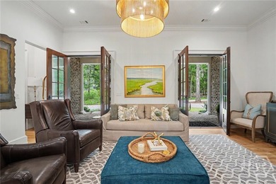 Tucked beneath a canopy of majestic live oaks draped in Spanish - photo 11