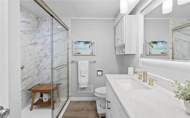 Wake up to sweeping ocean views from this beautifully refreshed - photo 12