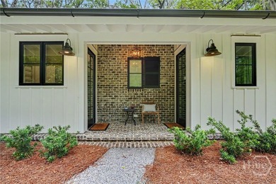 Tucked beneath a canopy of majestic live oaks draped in Spanish - photo 49