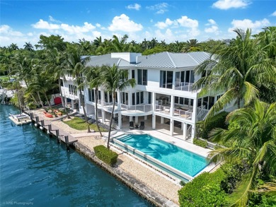 A private tropical oasis--waterfront estate with 150 FT of water
