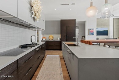 Located within a guard-gated enclave, this Paradise Valley